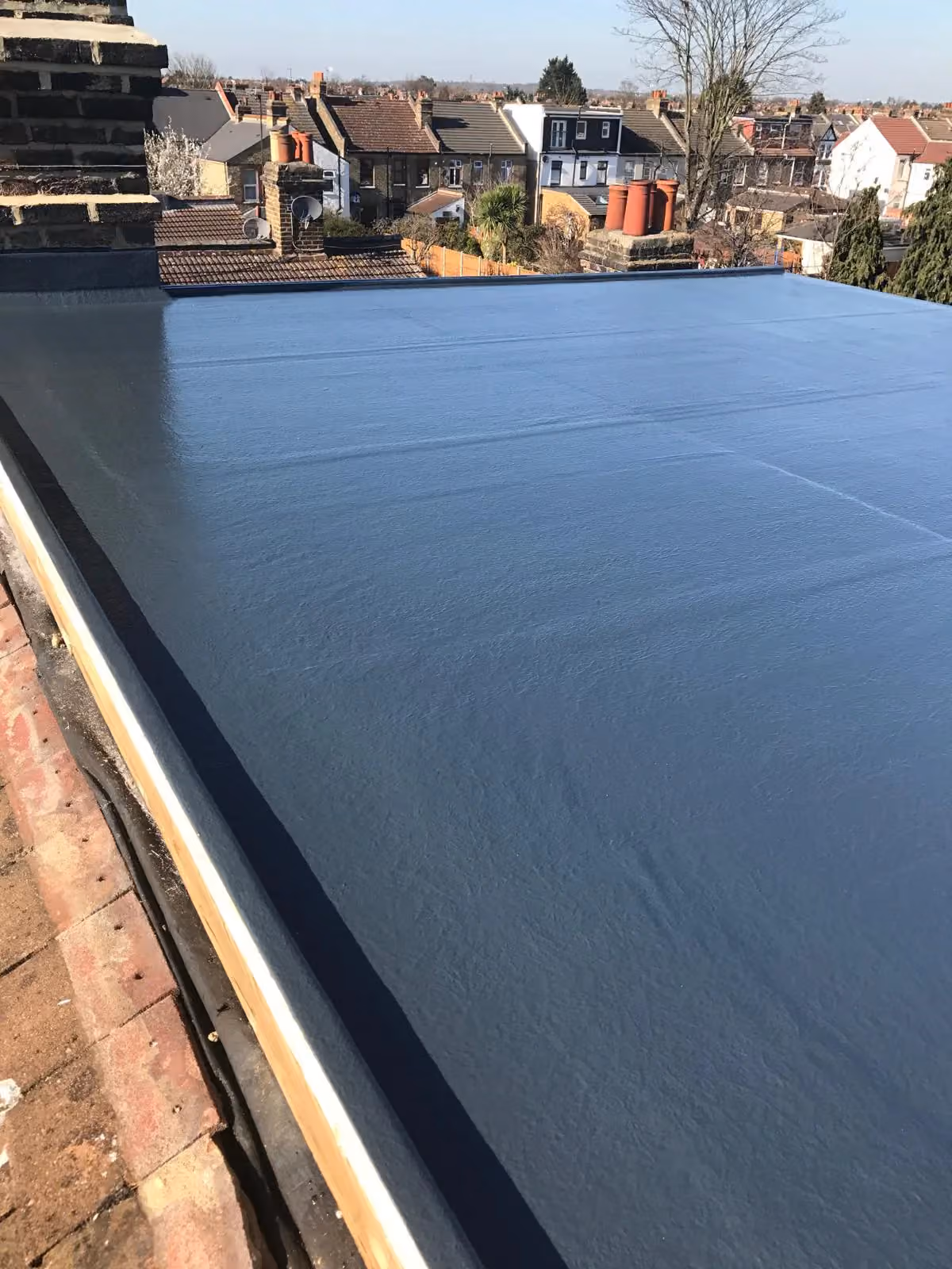 Completed dark grey GRP fibreglass flat roof in Ilford, Essex