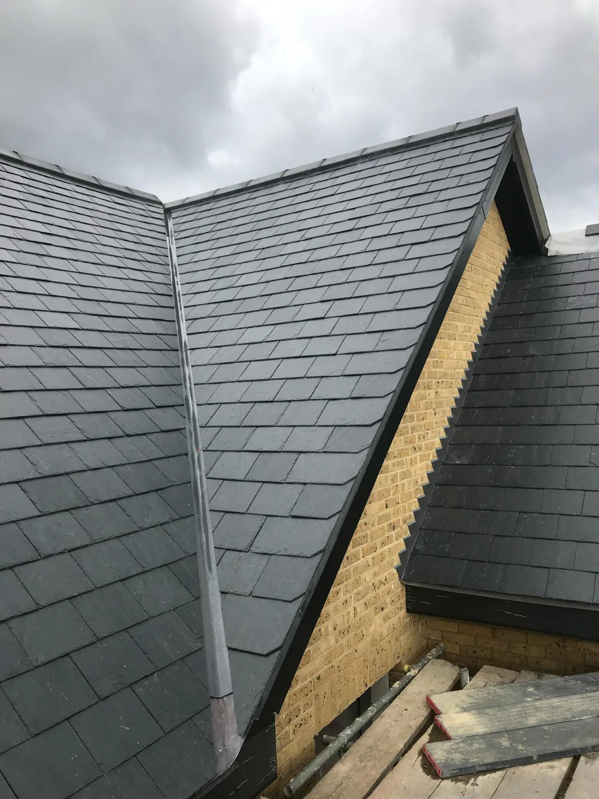 Newly completed natural slate roof installation by M.W. Beal & Son in Essex