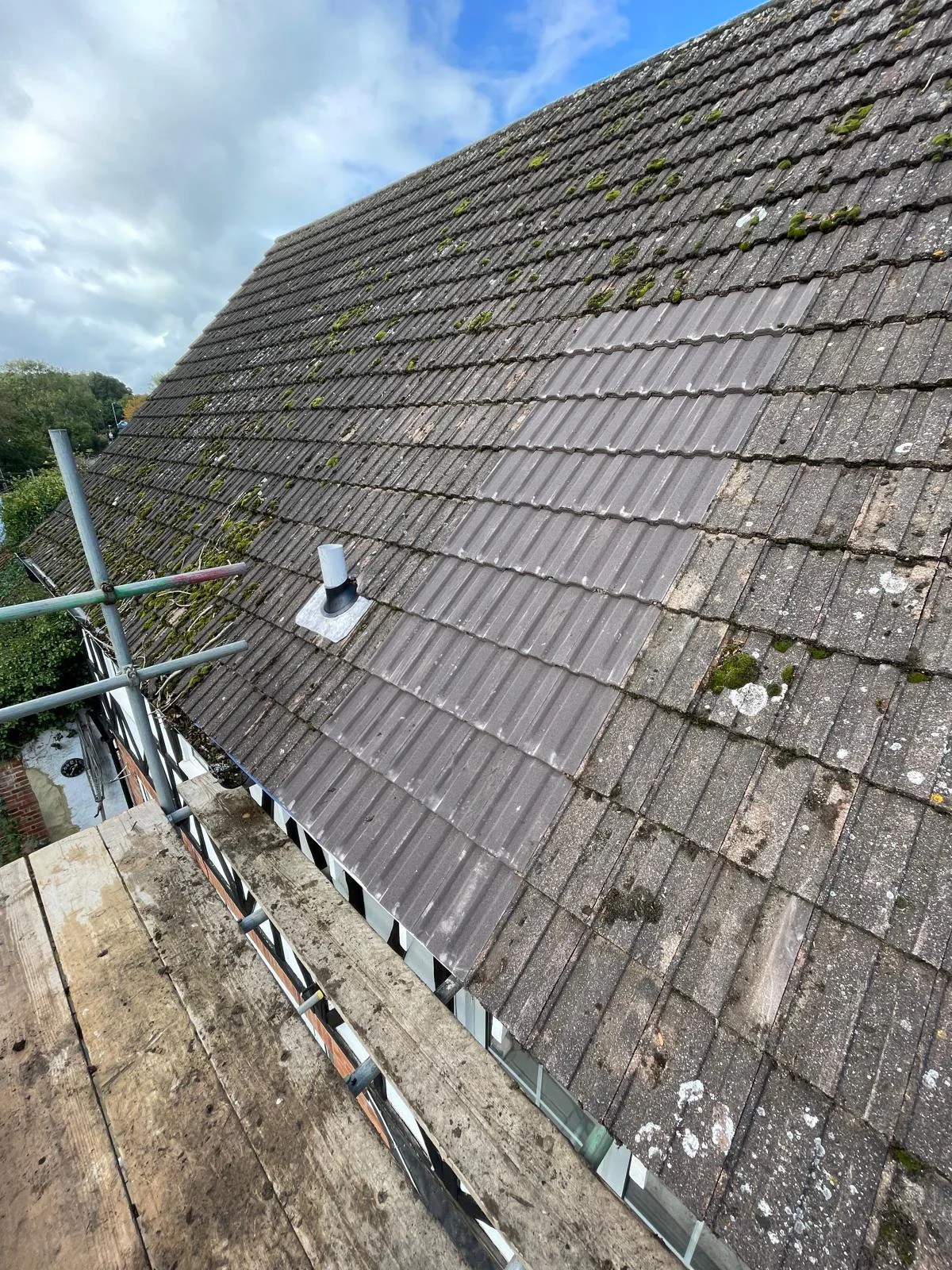 Roof repair in progress on a tiled roof in Billericay, Essex, by M.W. Beal & Son