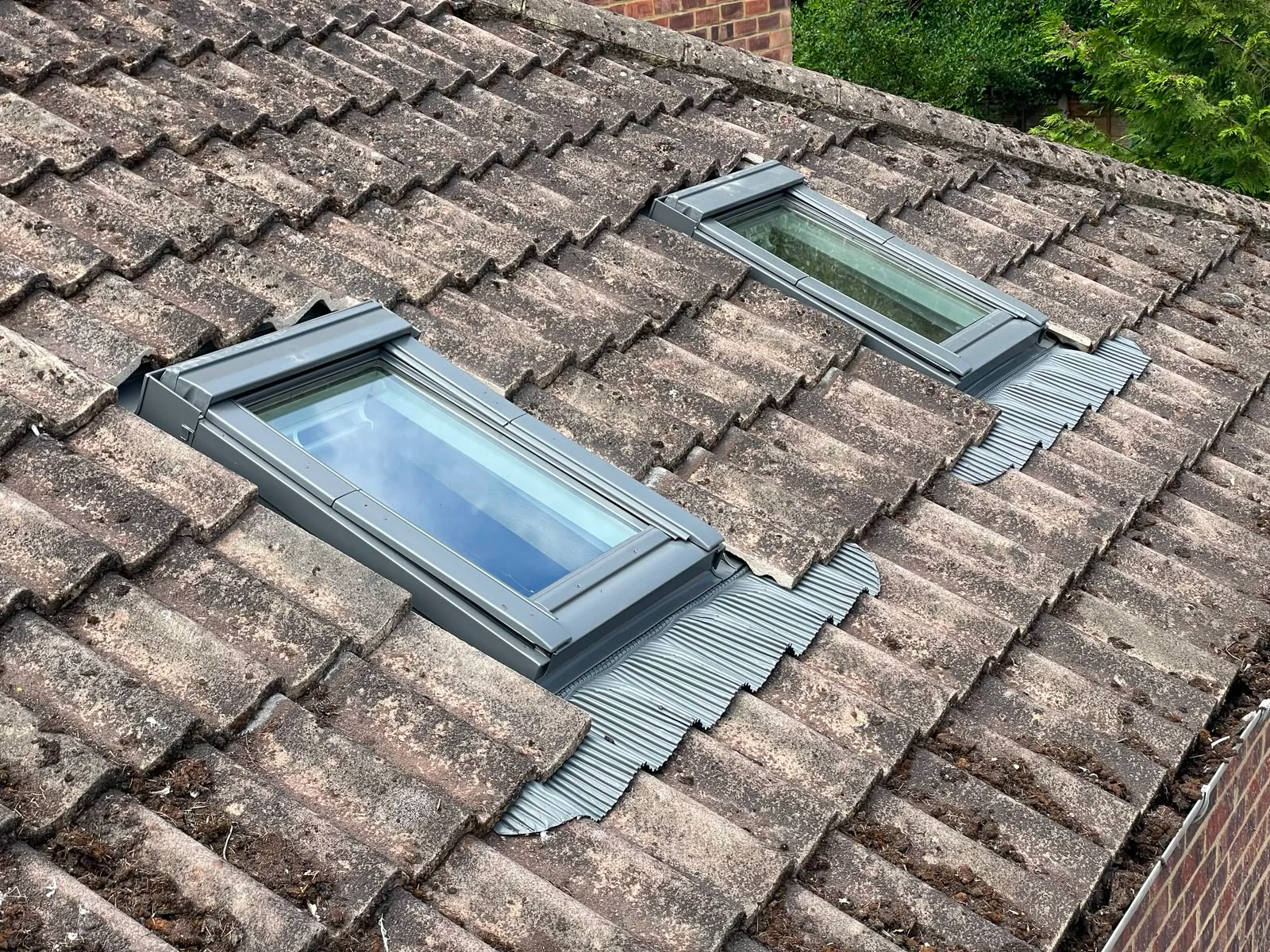 Two roof windows fitted into a concrete tile roof by M.W. Beal & Son in Essex